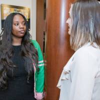 Jasmine Wilson (left) explaining her poster